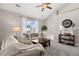 Comfortable living room with natural light, neutral decor, plush seating, and a view of the surrounding neighborhood at 22610 E Ontario Dr # 204, Aurora, CO 80016