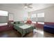 Cozy bedroom with green bedding and hardwood floors at 12831 Mayfair Way # F, Englewood, CO 80112