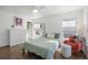 Bright bedroom featuring a ceiling fan, a large dresser, and comfortable seating at 12831 Mayfair Way # F, Englewood, CO 80112