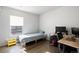 Small bedroom with twin bed and workspace at 12831 Mayfair Way # F, Englewood, CO 80112