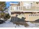 Rear view of townhouse showing attached garage and balcony at 12831 Mayfair Way # F, Englewood, CO 80112