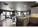 Open concept kitchen and living area with modern finishes at 12831 Mayfair Way # F, Englewood, CO 80112