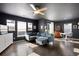 Bright living room featuring a sectional sofa and hardwood floors at 12831 Mayfair Way # F, Englewood, CO 80112