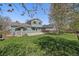 Spacious backyard with lush lawn, shed, and wood fence, perfect for outdoor activities at 381 Tynan Dr, Erie, CO 80516