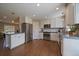 Bright, updated kitchen featuring stainless steel appliances and ample counter space at 381 Tynan Dr, Erie, CO 80516