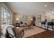Cozy living room with a large window, hardwood floors and modern decor at 381 Tynan Dr, Erie, CO 80516