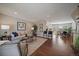 Spacious living room flows into the kitchen and dining area with hardwood floors at 381 Tynan Dr, Erie, CO 80516