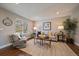 Bright living room features hardwood floors, neutral walls, and an inviting seating area at 381 Tynan Dr, Erie, CO 80516