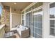 Outdoor patio featuring comfortable seating area and sliding glass doors for seamless indoor/outdoor living at 1560 Olympia Cir # 108, Castle Rock, CO 80104