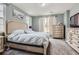 Bright bedroom with a bed, soft carpet and two windows allowing natural light at 1560 Olympia Cir # 108, Castle Rock, CO 80104
