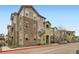 Multi-story apartment building featuring stone accents and manicured landscaping, providing a welcoming curb appeal at 1560 Olympia Cir # 108, Castle Rock, CO 80104