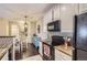 Charming kitchen with a breakfast bar and updated appliances for a seamless cooking experience at 1560 Olympia Cir # 108, Castle Rock, CO 80104