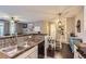 Open concept kitchen features tile floors, wood counters, and stainless steel appliances, blending style with function at 1560 Olympia Cir # 108, Castle Rock, CO 80104