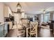Open concept living space featuring a dining room and kitchen with updated appliances and fixtures at 1560 Olympia Cir # 108, Castle Rock, CO 80104