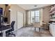 Bright office featuring a desk and chair set in front of a window and additional shelves at 1560 Olympia Cir # 108, Castle Rock, CO 80104