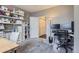 Bright home office with custom shelving and a comfortable workspace, ideal for remote work at 1560 Olympia Cir # 108, Castle Rock, CO 80104