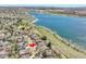 Aerial view of charming neighborhood next to a lake that features waterfront homes and picturesque scenery at 2590 W Long Cir, Littleton, CO 80120