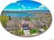 Stunning aerial view of home with lake and mountain views at 2590 W Long Cir, Littleton, CO 80120