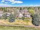 Aerial view of a charming home surrounded by mature trees and lush landscaping in a quiet neighborhood at 2590 W Long Cir, Littleton, CO 80120