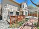 Inviting backyard with tiered deck, pergola, and a charming garden area, perfect for outdoor relaxation and entertaining at 2590 W Long Cir, Littleton, CO 80120