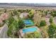 Aerial photo of a community pool and tennis courts surrounded by lush greenery at 2590 W Long Cir, Littleton, CO 80120
