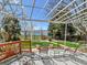Enjoy picturesque views from the covered patio with comfortable seating at 2590 W Long Cir, Littleton, CO 80120