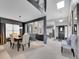 Inviting dining area showcasing modern lighting, fireplace, and seamless open floor plan at 2590 W Long Cir, Littleton, CO 80120