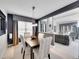 Elegant dining room featuring stylish decor and seamless connection to the cozy living area at 2590 W Long Cir, Littleton, CO 80120