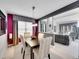 Beautiful dining room boasting an open-concept design connected to the living area at 2590 W Long Cir, Littleton, CO 80120
