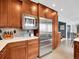 Modern kitchen equipped with stainless steel appliances and plenty of cabinet storage at 2590 W Long Cir, Littleton, CO 80120