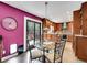 Cozy kitchen with stainless steel appliances, a glass-top dining table, and an adjacent outdoor patio at 2590 W Long Cir, Littleton, CO 80120