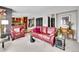 Open living room with hardwood floors leading to kitchen, leather furniture, and neutral color palette at 2590 W Long Cir, Littleton, CO 80120