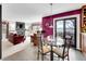 Inviting open floorplan with kitchen, breakfast nook, and living space with fireplace at 2590 W Long Cir, Littleton, CO 80120