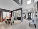 Open-concept living space featuring a dining area, modern decor, and great natural light at 2590 W Long Cir, Littleton, CO 80120