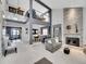 Stylish living room featuring high ceilings, stone fireplace, and open floor plan at 2590 W Long Cir, Littleton, CO 80120