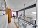 Bright loft area with glass railing overlooking the living space, featuring a comfortable office setup at 2590 W Long Cir, Littleton, CO 80120