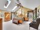 Spacious primary suite features a four-poster bed, skylights, and ample natural light at 2590 W Long Cir, Littleton, CO 80120