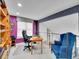 Well-lit office space featuring a comfortable workspace, built-in shelving, and modern accents at 2590 W Long Cir, Littleton, CO 80120