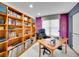 Inviting home office with custom shelving, natural light, and views to the living space below at 2590 W Long Cir, Littleton, CO 80120
