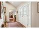 Bright entryway with hardwood floors and stained glass doors at 4530 S Verbena St # 309, Denver, CO 80237