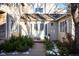 Charming front entrance with double doors and landscaping at 4530 S Verbena St # 309, Denver, CO 80237