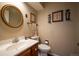 Small powder room with a single sink and toilet at 4530 S Verbena St # 309, Denver, CO 80237
