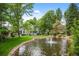 Pond with fountain in front of townhouses at 4530 S Verbena St # 309, Denver, CO 80237