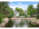 Townhouses with a pond and fountain in the front at 4530 S Verbena St # 309, Denver, CO 80237