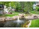 Serene pond with a waterfall and fountain, creating a relaxing outdoor space at 4530 S Verbena St # 309, Denver, CO 80237