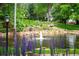 Pond with fountain and landscaping, featuring a bridge at 4530 S Verbena St # 309, Denver, CO 80237