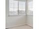 Well-lit bedroom with plush carpet and a large window offering natural light and neighborhood views at 4290 Cottonwood Lakes Blvd, Thornton, CO 80241