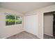 Bedroom with a view, closet space, and neutral decor at 7325 S Houstoun Waring Cir, Littleton, CO 80120