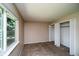 Bedroom with large window, closet, neutral walls and plush carpeting at 7325 S Houstoun Waring Cir, Littleton, CO 80120