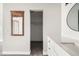 Bathroom features a white vanity with quartz countertop and modern fixtures at 15350 E Arizona Ave # 308, Aurora, CO 80017